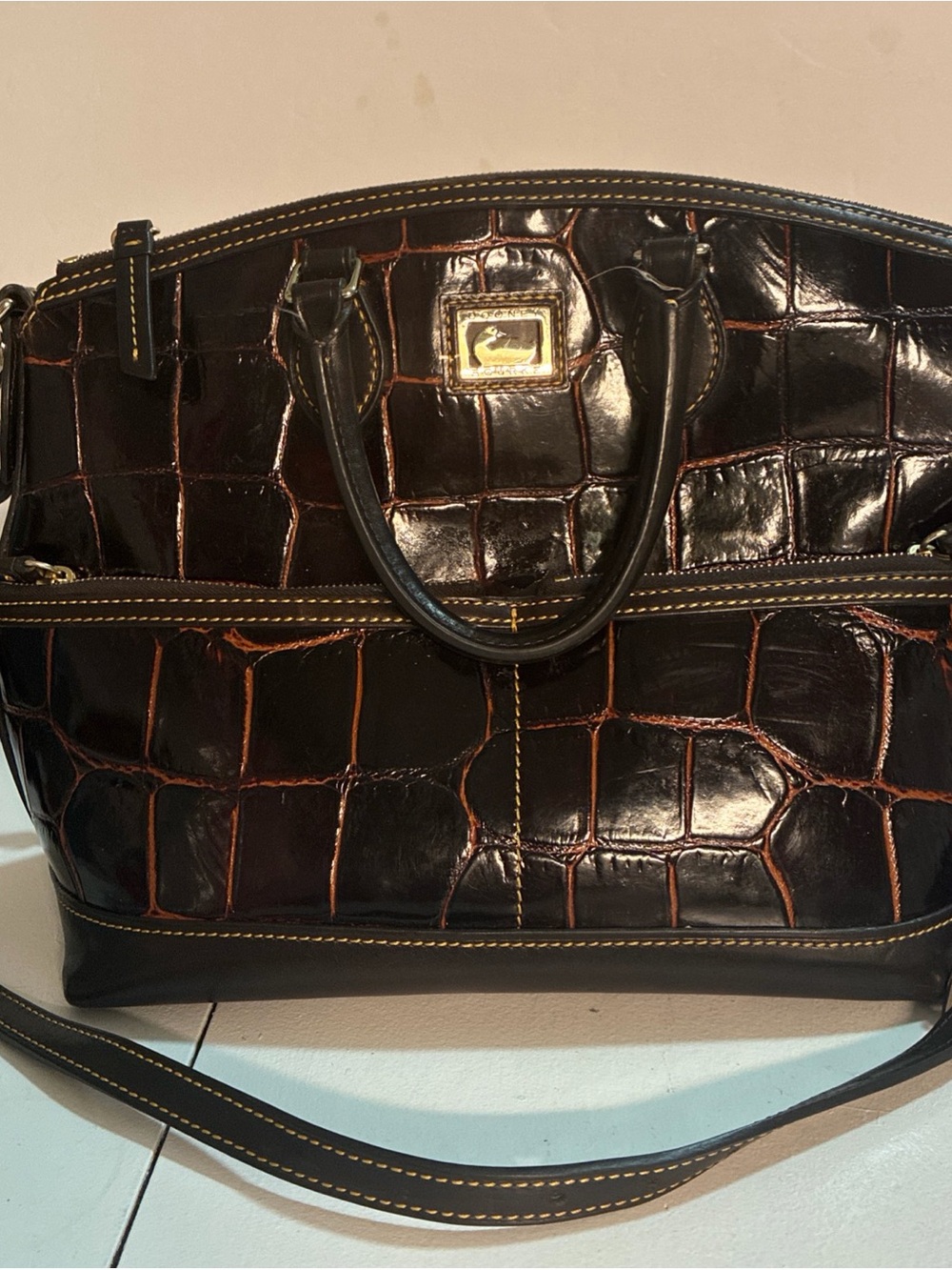 Dooney & Bourke Croc-Embossed Dark Brown Satchel with Contrast Stitching.